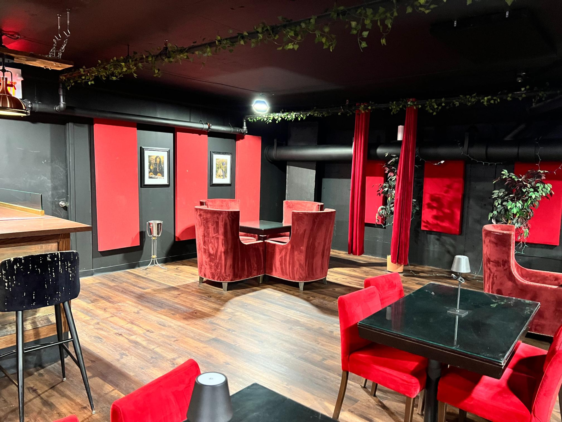 Intimate lounge seating with red velvet chairs