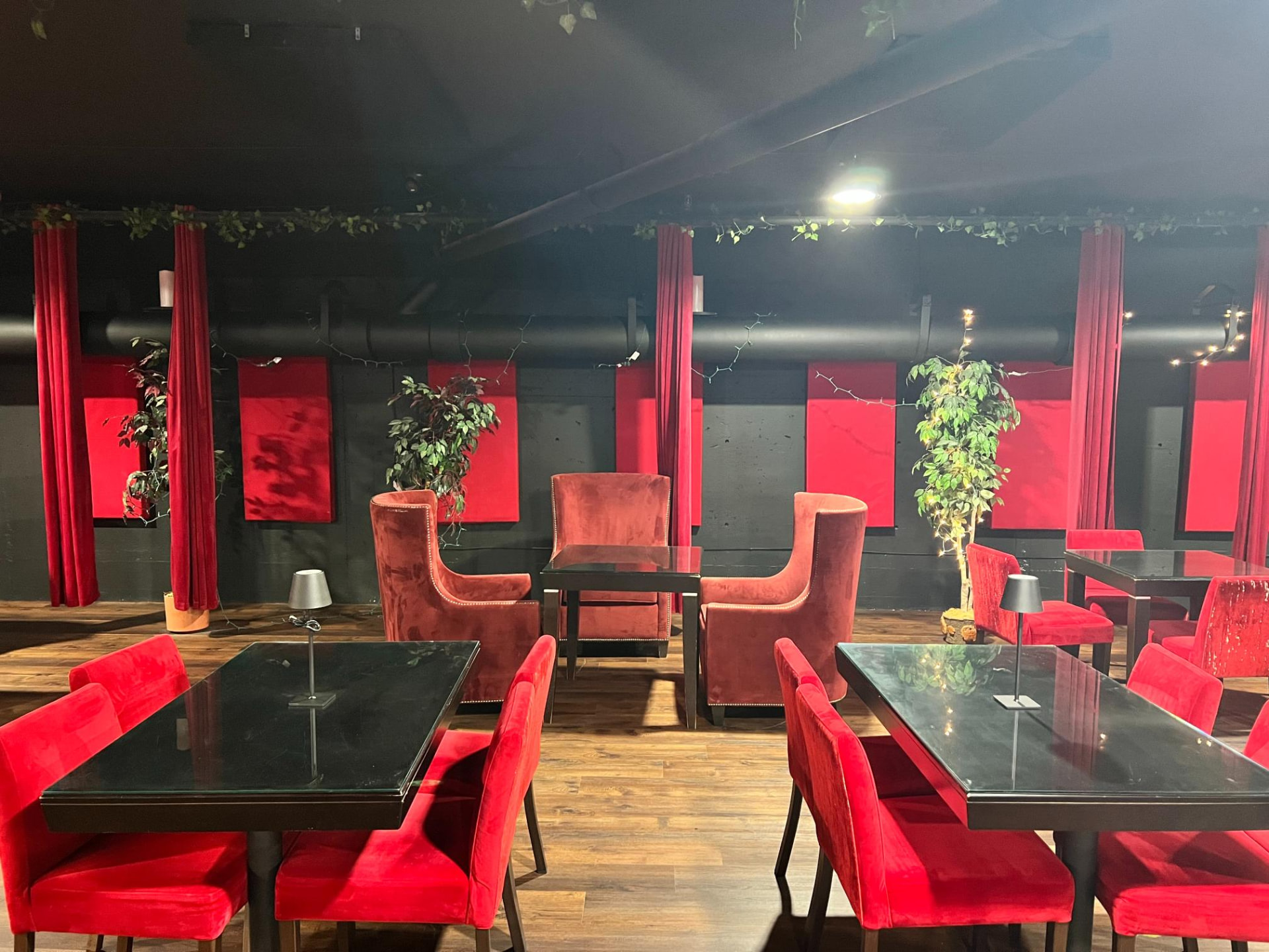 Lounge dining tables and red velvet seating